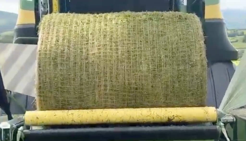 Close-up of hay bale wrapped with Kiwi EcoNet bale net made by Krone baler